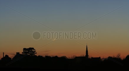 Crescent Moon 27 hours and village steeple France