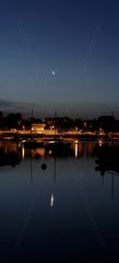 Moon and Venus reflected in the river Odet France
