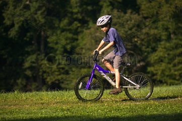 Boy on bicycle Pennsylvania USA