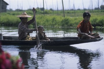 Family in boat on the lake Inle Myanmar