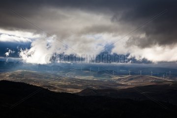 Windmills on hill under the clouds Andalusia Spain