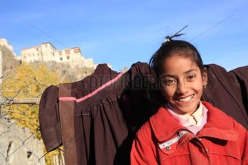 Girl posing in front of the monastery in India Karcha