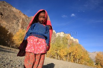 Girl playing with a scarf in front of the monastery Karcha