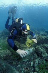Diver cleaning the sea bed in Monaco