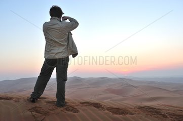 Photographer in the desert of Rub al-Khali Abu Dhabi