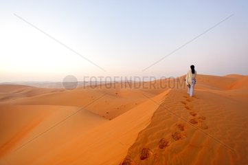 Tourists walking in the desert of Rub al-Khali Abu Dhabi