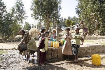 Women and children drawing water from Ethiopia