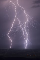 Triple lightning strike during a night storm dry Jura France