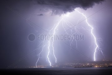 Quadruple lightning strike hitting the Lake Geneva Switzerland