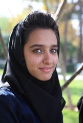 Young woman showing her hair veiled Iranian Iran Isfahan