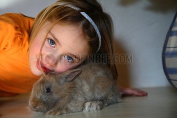 Portrait of a young child with a rabbit