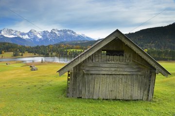 Old barn in front of Karwendel Moutains in autumn Germany