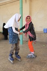 Children dancing with rollerblades at Chak Chak in Iran
