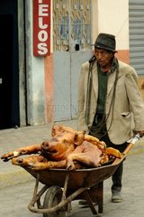 Transporting a Pork Roast market Saquissili Ecuador
