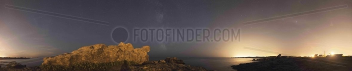 The Milky Way emerges from the sea in Brittany France