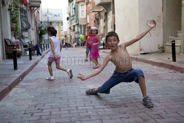 Children playing football in an alley Turkey