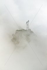 Pylon in the fog Massif de l'Oisans Alpes France