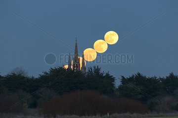 Wolf Moon rise behind the tower Tronoën France