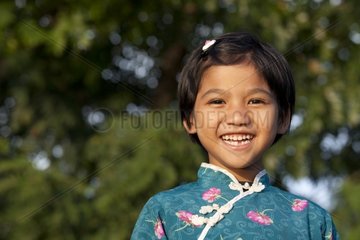 Portrait of girl smiling edge of Inle Lake Burma Nyaungshwe