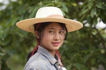 Portrait of young woman with a hat Burma