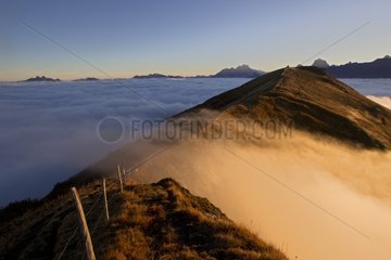 Sea of fog over a ridge Valais Alps Switzerland