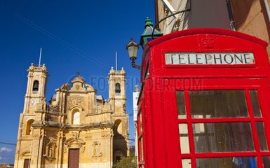 Telephone booth and Church of Gharb Gozo Malta