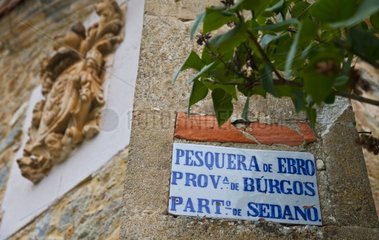 Blazon and antique sign at Pesquera de Ebro Spain