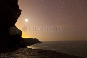 La Ojerada cave by full moon on Cantabrian coast in Spain