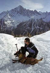 Dog and dog handler in response to avalanche the Alps