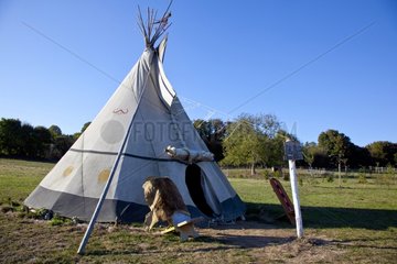 Chair in front of a Teepee