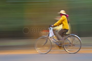 People bicycle Angkor Thom Cambodia