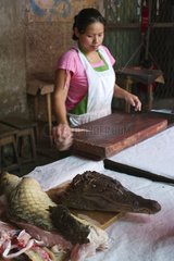 Caiman being sold for meat in Belen Market Iquitos Peru