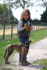 Girl taking a Greyhound on a leash France