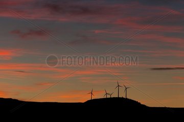 Windmills on hill at twilight Aragon Spain