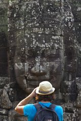 Tourist at the Bayon temple at Angkor in Cambodia