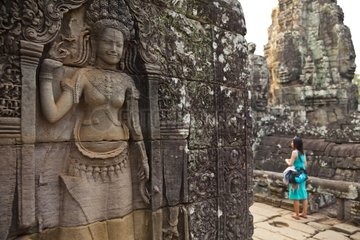 Tourist at the Bayon temple at Angkor in Cambodia