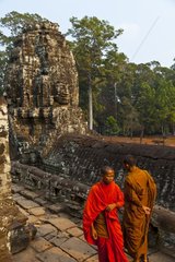 Buddhist monks at the Bayon temple at Angkor in Cambodia
