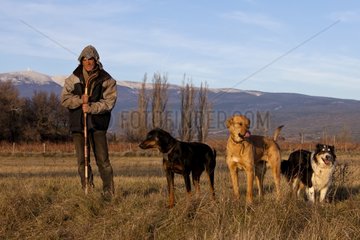 Herdsman and his dog in winter Provence France]