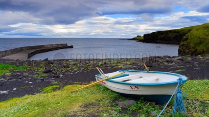 Boat and beach of black sand-Snaefellsnes Peninsula Iceland