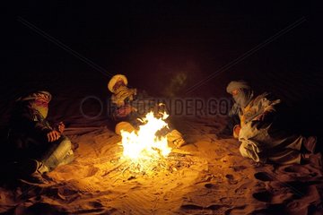 Camel men around a fire in the Draa Valley in Morocco