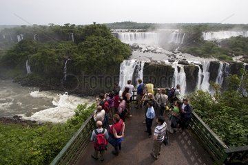 Tourists on lookout Iguazu Falls Parana Brazil