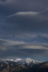 Lenticular clouds over Mt Canigou Pyrenees France