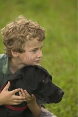 Portrait of a boy with a Labrador Pennsylvannia USA