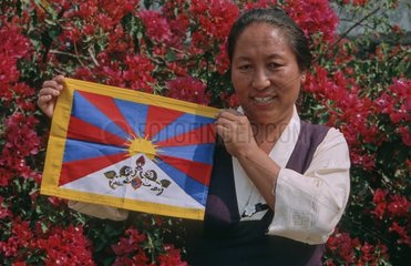 Teacher holding a Tibetan flag