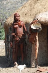 Himba woman outside her hut in Namibia