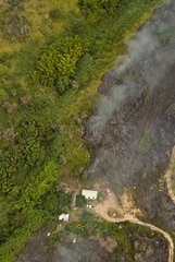 Bush fire near a home New Caledonia