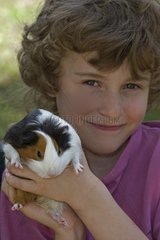 Boy holding a Guinea pig