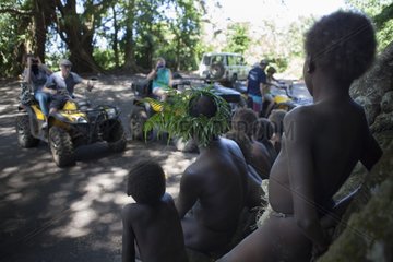 Tourists photographing children - Tanna Island Vanuatu