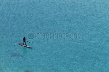 Man practicing Stand up paddle surfing in Cape Taillat