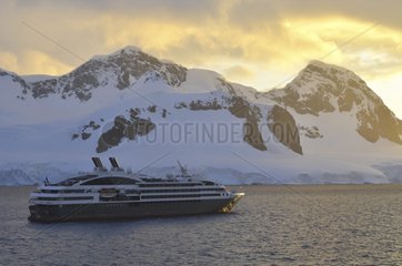 Cruise ship off the coast of Antarctica at dusk